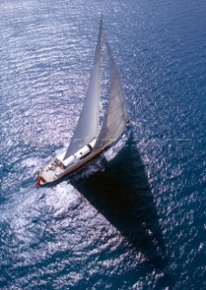 Luxury superyacht Red Dragon under sail in calm tropical seas of the Caribbean