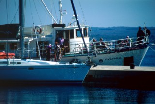 Boats moored at dockside, Brijoni Islands, Croatia