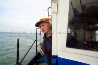 Andy Riches Oyster fisherman. Oyster fishing Whitstable Kent, for Pacific and Native Oysters on the the traditional Oyster beds on the North Kent Coast of England. Fishering for Pacfic and Native oyster for the Whitstable Oyster fishery Company