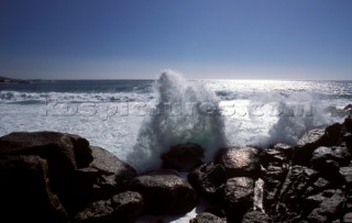 Wave crashing over rocks at Llundudno, Cape Town, South Africa