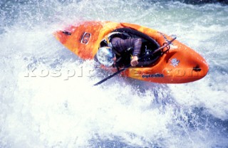 Canoeist makes sharp turn over rapids on the Zambezi River, Zambia