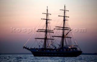 Sqaure rigger anchored at sunset