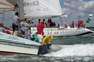 Photographers shooting Simon Le Bon of Duran Duran as he sails his maxi yacht Arnold Clark Drum across the startline of the Fastnet Race 2005