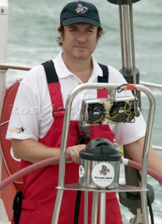 Duran Duran star Simon Le Bon at the helm of maxi yacht Arnold Clarke Drum at the start of the Rolex Fastnet Race 2005