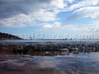 Waves and wabeletts lapping on a sandy beach