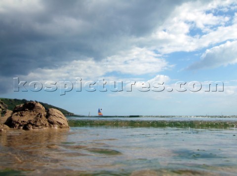 Waves and wabeletts lapping on a sandy beach