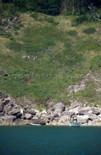 Cruising yacht at anchor in a tranquile secluded bay