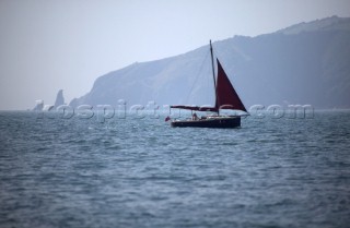 A lone man on a Cornish Shrimper approaches Dartmouth