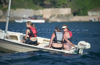 Family of people in a day boat with outboard engine