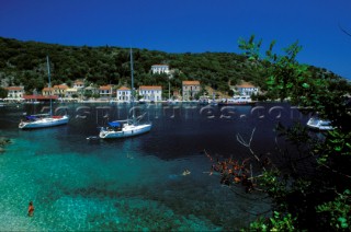 Cruising yachts moored in Kioni Harbour, Ithaca, Greek islands