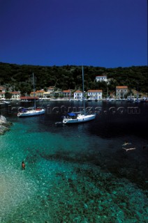 Cruising yachts moored in Kioni Harbour, Ithaca, Greek islands