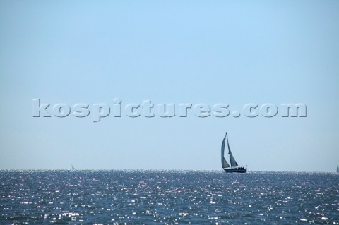 Single yacht sailing on open sea