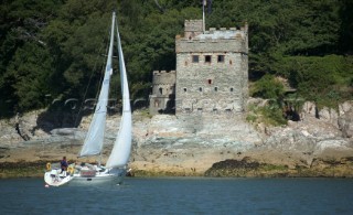 Cruising yacht sailing off Dartmouth, Devon, UK