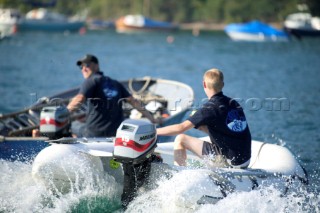 Two dinghies driving through the harbour at Dartmouth