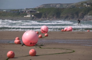 Mooring bouys on sandy beach at low tide. Bantham, Devon