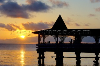 Pontoon on the beach at Dickensons Bay at sunset, Antigua