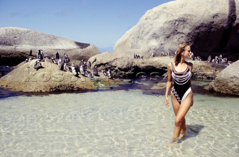 Woman on penguin beach South Africa