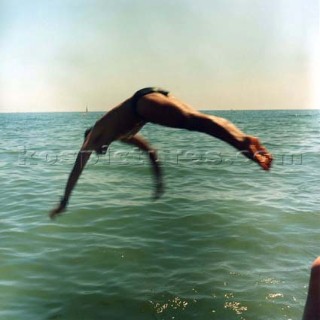 Man diving into sea at Brighton beach