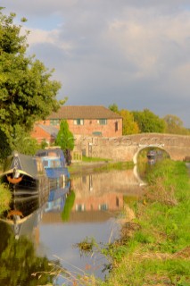 Waterside; canal; canals; Montgomery canal; narrow boat; narrow boats; moorings; canalside; Maesbury; Shropshire; UK.