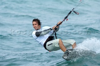 Kitesurfer powers through the water in strong breeze