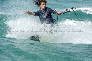 Kitesurfer makes turn in strong winds