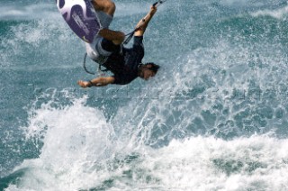 Kitesurfer get big air off wave in strong winds