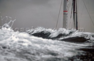 Yacht in large waves and rough sea