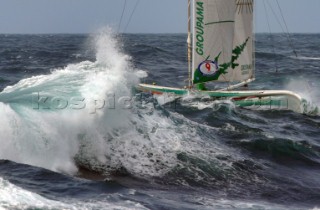 Yacht in large waves and rough sea