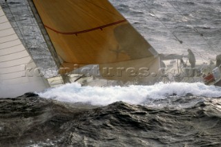 Yacht in large waves and rough sea