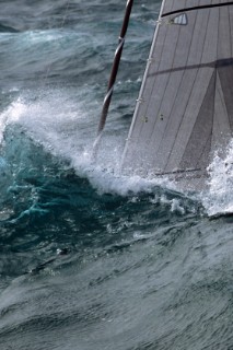 Yacht in large waves and rough sea