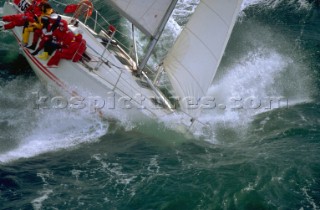 Yacht in large waves and rough sea