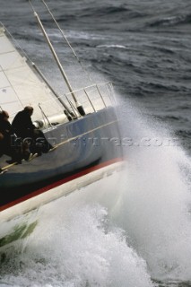 Yacht in large waves and rough sea