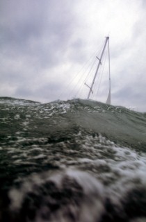 Yacht in large waves and rough sea