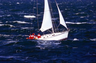 Yacht in large waves and rough sea