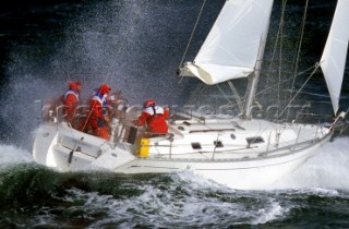 Yacht in large waves and rough sea