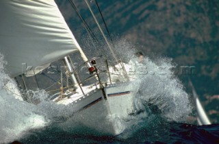 Yacht in large waves and rough sea