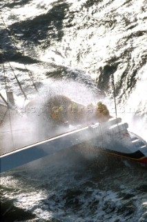 Yacht in large waves and rough sea