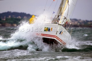 Yacht in large waves and rough sea