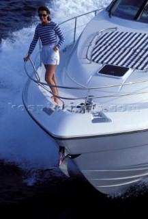 Male and female models relaxing and socialising on a luxury Fairline powerboat