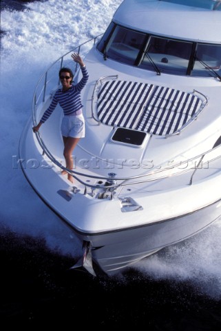 Male and female models relaxing and socialising on a luxury Fairline powerboat