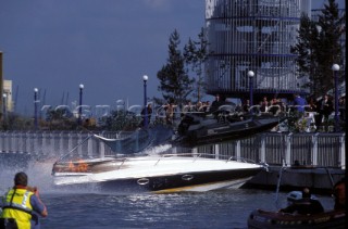 James Bond crashes through a Sunseeker powerboat in his jet boat during a dangerous stunt in the movie The World Is Not Enough