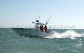 Conch 27 powerboat at speed off Key West, Florida, USA. Key West