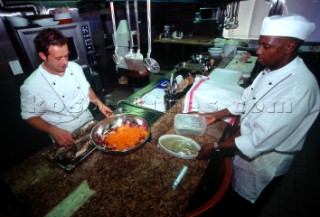 Crew and cook preparing meal and food. Flavio  Briatore Managing Director of Renault F1 Team France in Viry-Châtillon, on board of his yacht Force Blue. SALES ONLY FOR UK