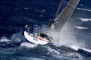 Skandia sailing along the Tasmanian coast, Australia. 85 yachts of all sizes battled for this years line honors in this the 61st running of the world famous race.