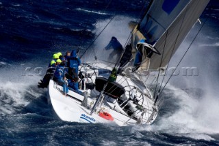 Skandia sailing along the Tasmanian coast, Australia, Dec., 28, 2005. 85 yachts of all sizes battled for this years line honors in this the 61st running of the world famous race.