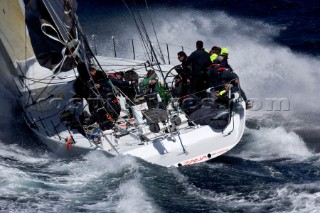 Konica Minolta sailing along the Tasmanian coast, Australia,Dec. 28, 2005. 85 yachts of all sizes battled for this years line honors in this the 61st running of the world famous race.