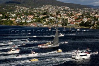 Sailing and racing yachts leave Sydney harbour in the 2005 Rolex Sydney Hobart race