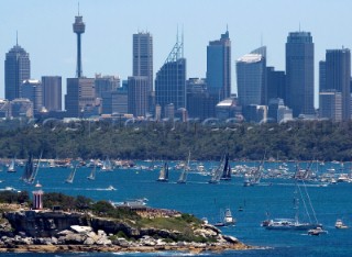 Sailing and racing yachts leave Sydney harbour in the 2005 Rolex Sydney Hobart race