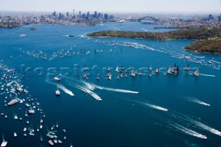 Sailing and racing yachts leave Sydney harbour in the 2005 Rolex Sydney Hobart race