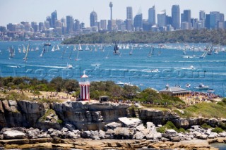 Sailing and racing yachts leave Sydney harbour in the 2005 Rolex Sydney Hobart race